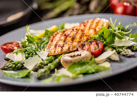 Grilled chicken breast with asparagus. Grilled chicken breast with asparagus. 40744774