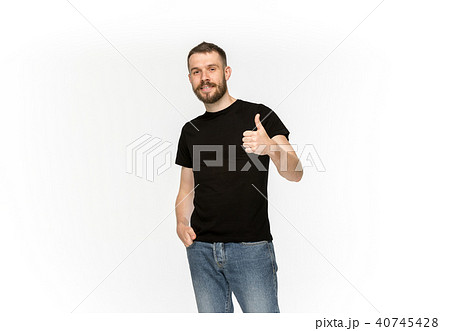 Closeup of young man's body in empty black t-shirt isolated on white background. Mock up for disign 40745428