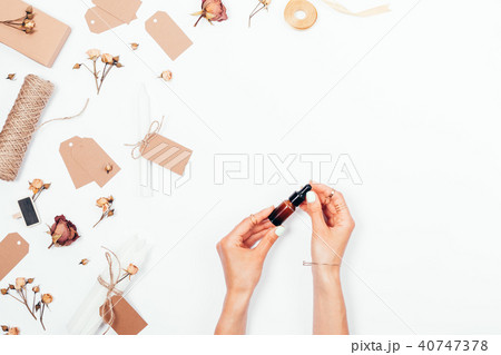 Top view female's hands holds essential Top view female's hands holds essential 40747378