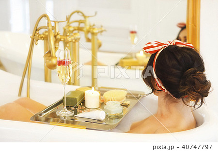 Girl relaxing in bath on light background 40747797