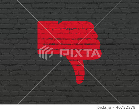 Social network concept: Thumb Down on wall background 40752579
