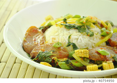 spicy stir fried Chinese pork sausage with basil  40754950