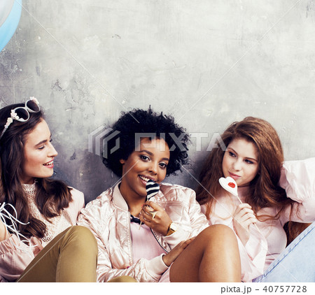 Lifestyle and people concept: young pretty diversity nations wom Lifestyle and people concept: young pretty diversity nations wom 40757728