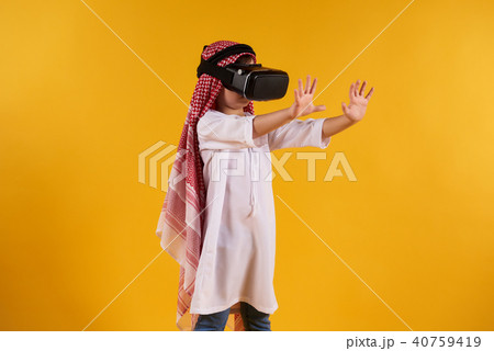 Arabian happy boy with virtual reality glasses Arabian happy boy with virtual reality glasses 40759419