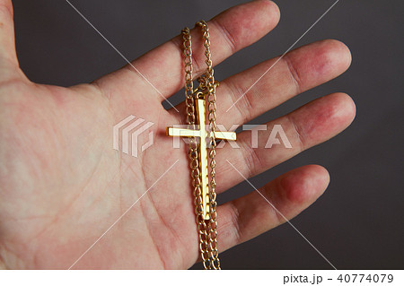 hand holds the cross hand holds the cross 40774079