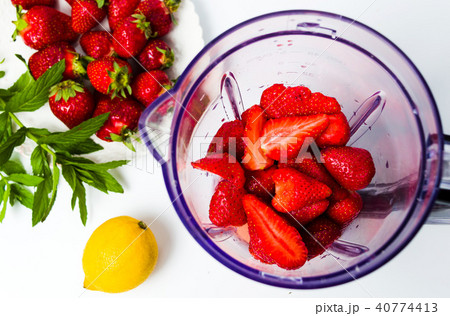 Strawberry smoothie ingredients in a blender Strawberry smoothie ingredients in a blender 40774413