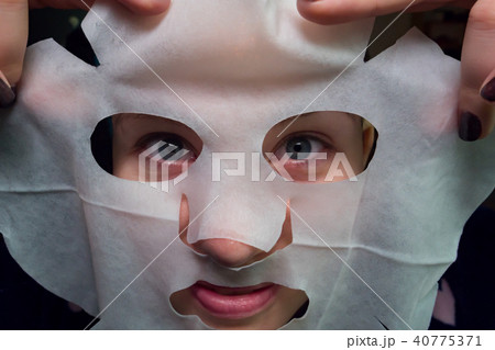 Funny image of young with facial mask looking at camera 40775371