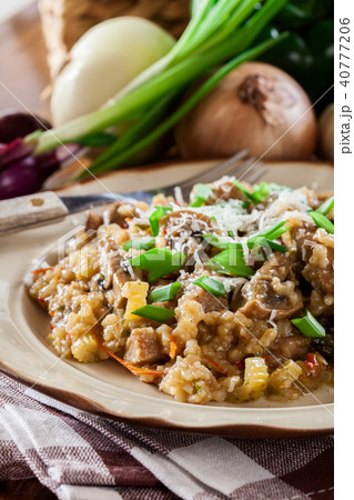 Risotto with champignon mushrooms and pork 40777206
