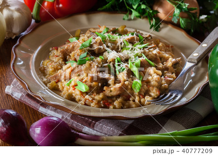 Risotto with champignon mushrooms and pork 40777209