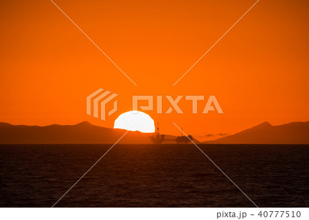 California Huntington Beach  Oil Rig & Sunset  40777510