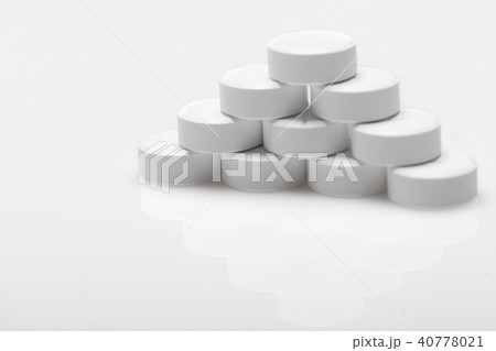 white pills on blue background white pills on blue background 40778021