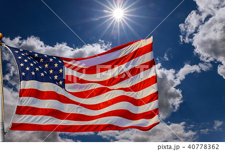 American flag on a post with cloudy background 40778362