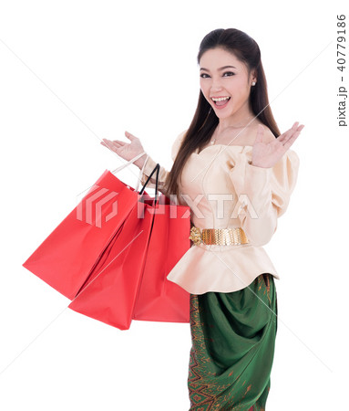 woman in Thai traditional dress holding a shopping bag isolated 40779186