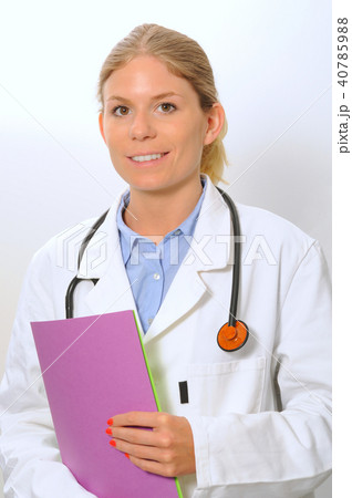 Smiling woman doctor closeup with files in arms Smiling woman doctor closeup with files in arms 40785988