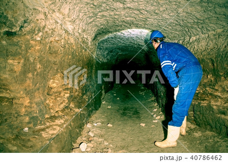 Man in old stronghold. Bastion tunnel under city 40786462
