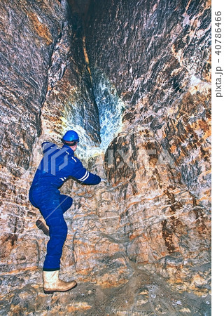 Worker in tunel. Staff in blue suit check sediment Worker in tunel. Staff in blue suit check sediment 40786466