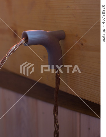 Vintage wire cable plastic holder on the wooden wall Vintage wire cable plastic holder on the wooden wall 40788820