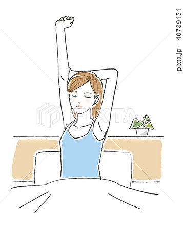 ベッドの上で背伸びをする女性のイラスト素材
