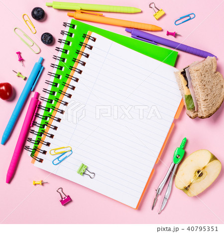 School background with notebooks and colorful supplies School background with notebooks and colorful supplies 40795351