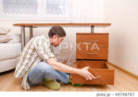 Photo of man picking curb at table Photo of man picking curb at table 40798767