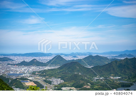 讃岐平野の風景 高松市市街地 山々 の写真素材