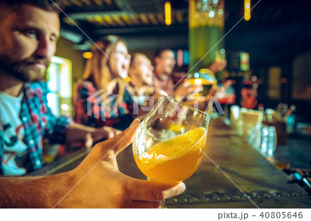 Sport, people, leisure, friendship and entertainment concept - happy football fans or male friends 40805646