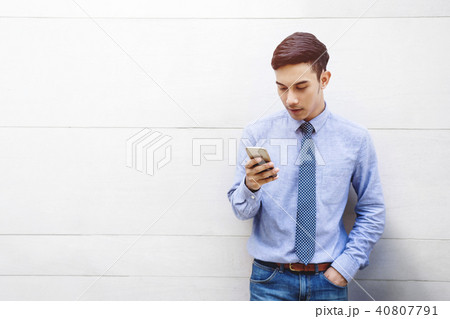 Portrait of Young Businessman using Smartphone 40807791