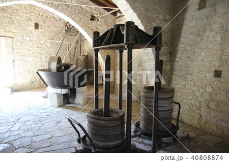 Ancient olive oil production machinery, stone mill and mechanical press Ancient olive oil production machinery, stone mill and mechanical press 40808874