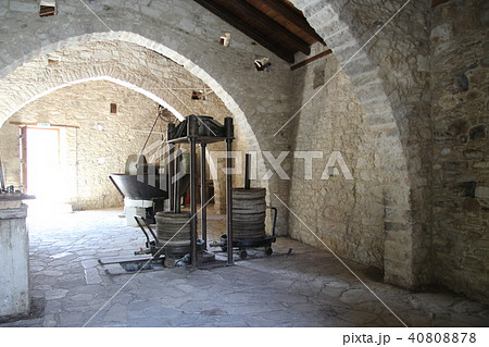 Ancient olive oil production machinery, stone mill and mechanical press 40808878
