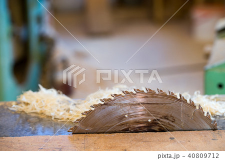Carpenter tools on wooden table with sawdust. Circular Saw. Cutting a wooden plank Carpenter tools on wooden table with sawdust. Circular Saw. Cutting a wooden plank 40809712