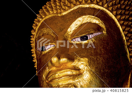 Golden buddha statue imagery in Buddhist temple  40815825