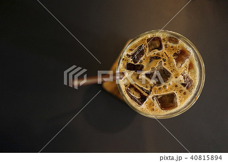 Iced coffee latte in a tall glass with cream  40815894
