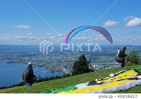 Paraglider over the Zug city, Zugersee and Swiss Alps, Switzerland Paraglider over the Zug city, Zugersee and Swiss Alps, Switzerland 40816827