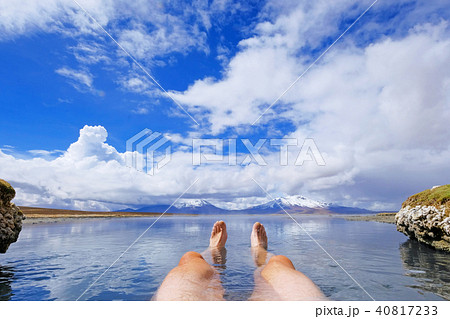 The legs of an athletic man in natural thermal hot spring Polloquere, Salar De Surire salt lake The legs of an athletic man in natural thermal hot spring Polloquere, Salar De Surire salt lake 40817233