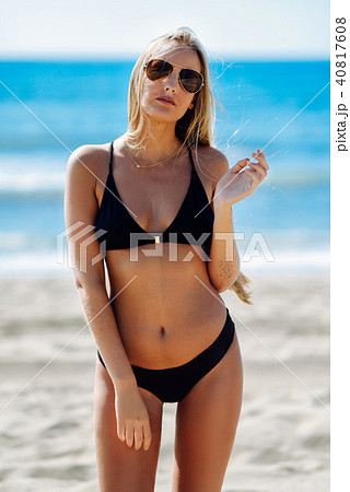 Blond woman in swimwear on the beach 40817608