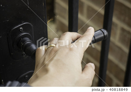 Woman hand hold on opening door 40818849