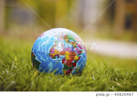 Globe lies on green grass 40820467