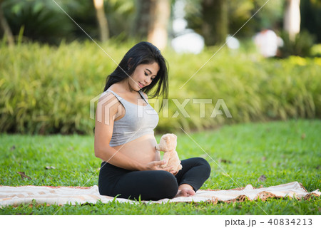 portrait of pregnant women on green background portrait of pregnant women on green background 40834213