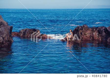 beautiful girl resting in natural ocean swimming pool 40841780