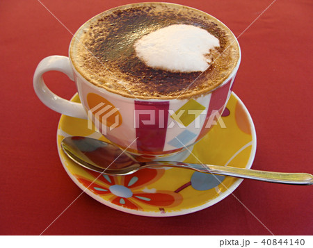 White Cup with a gourmet coffee and foam figure 40844140