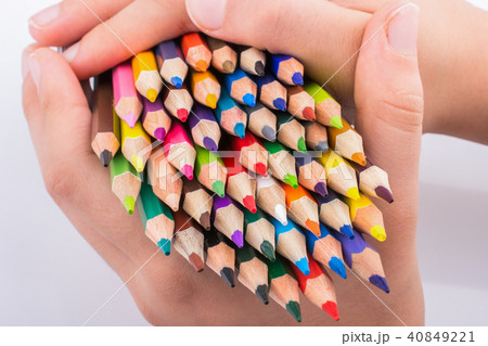 Hand holding Color Pencils 40849221