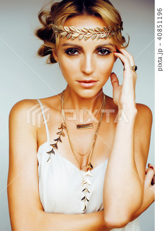 young blond woman dressed like ancient greek godess, gold jewelr young blond woman dressed like ancient greek godess, gold jewelr 40851196