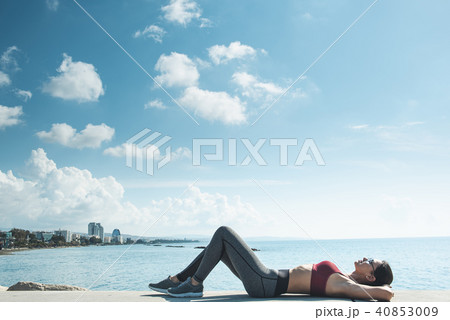 Happy athlete relaxing after doing sport 40853009