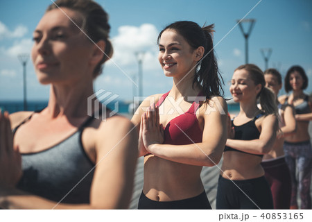 Glad females doing gymnastic exercise Glad females doing gymnastic exercise 40853165