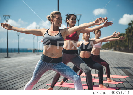 Cheerful females doing physical exercises 40853211