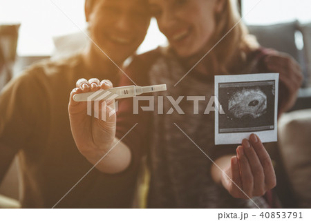 Joyful pregnant woman telling her husband good news Joyful pregnant woman telling her husband good news 40853791