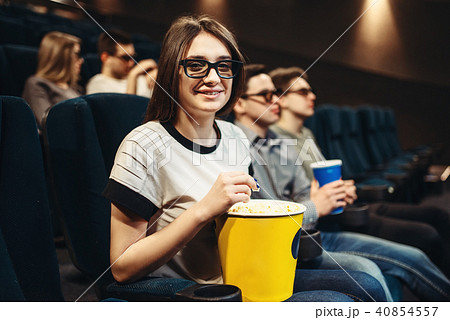 Woman in 3d glasses sitting on seat in cinema 40854557