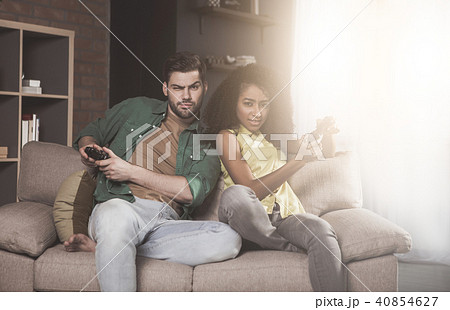 Serious girlfriend and boyfriend are enjoying xbox Serious girlfriend and boyfriend are enjoying xbox 40854627