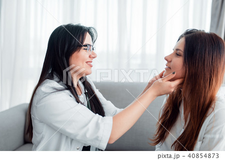 Young wife at family doctor reception 40854873