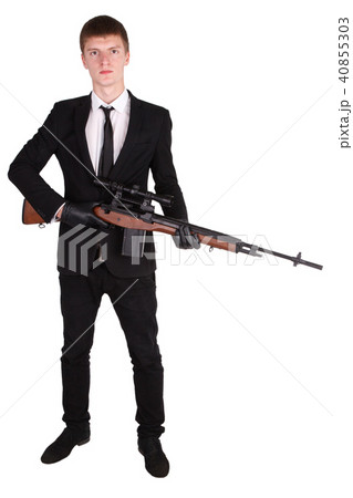 Man in suit with sniper rifle Man in suit with sniper rifle 40855303